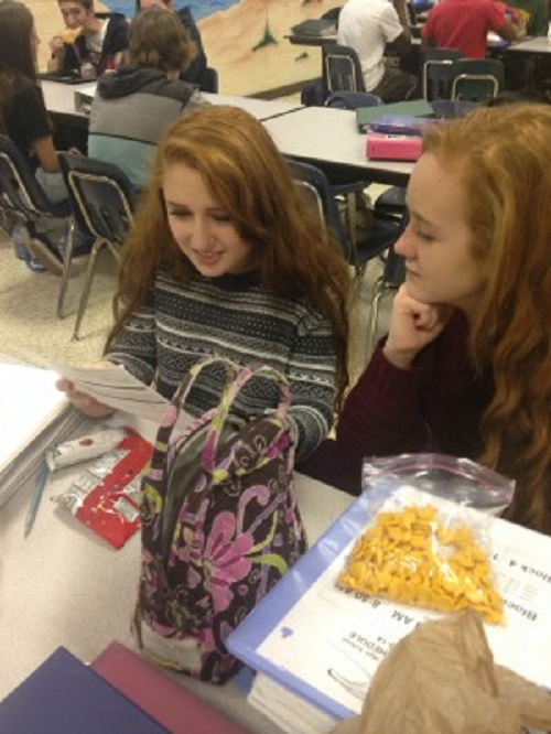 FRESHMAN HANNAH OBAIDY and Julia Molodow converse about schedules during their lunch period.