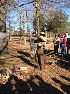 CIVIL WAR REENACTOR demonstrates the use of firearms during the war.