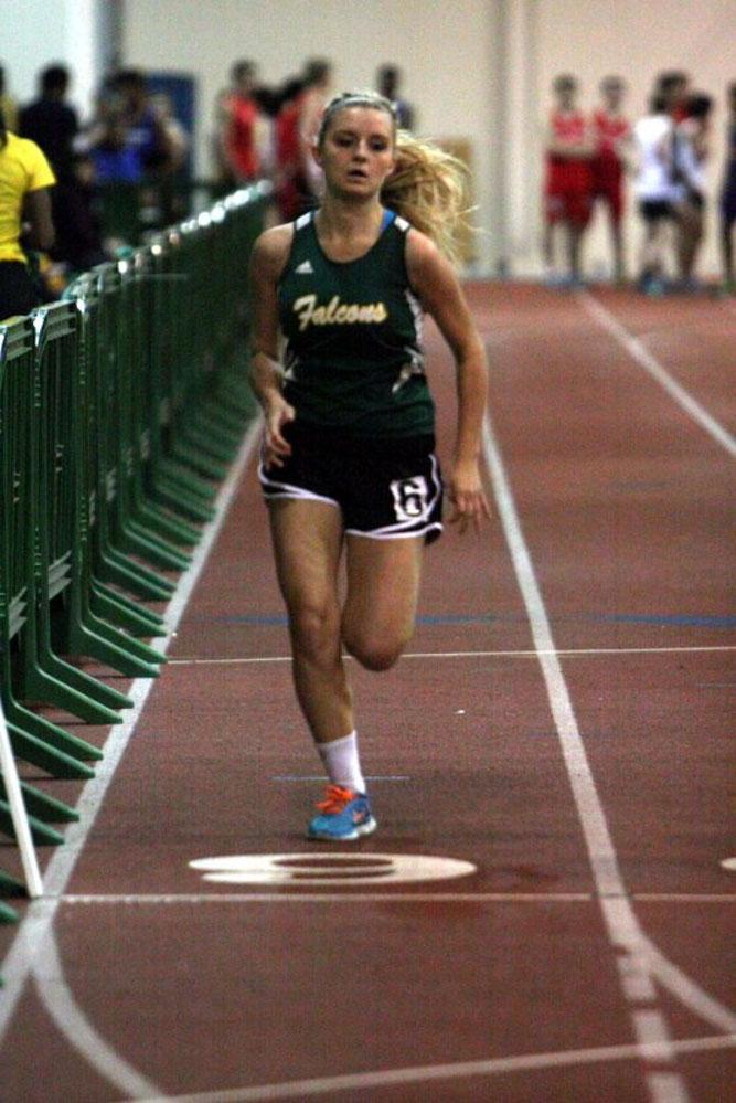 INDOOR TRACK ATHLETE sophomore Michelle Jones runs the 300m at the Conference 1/9 meet at the Boo Williams Complex in Hampton.