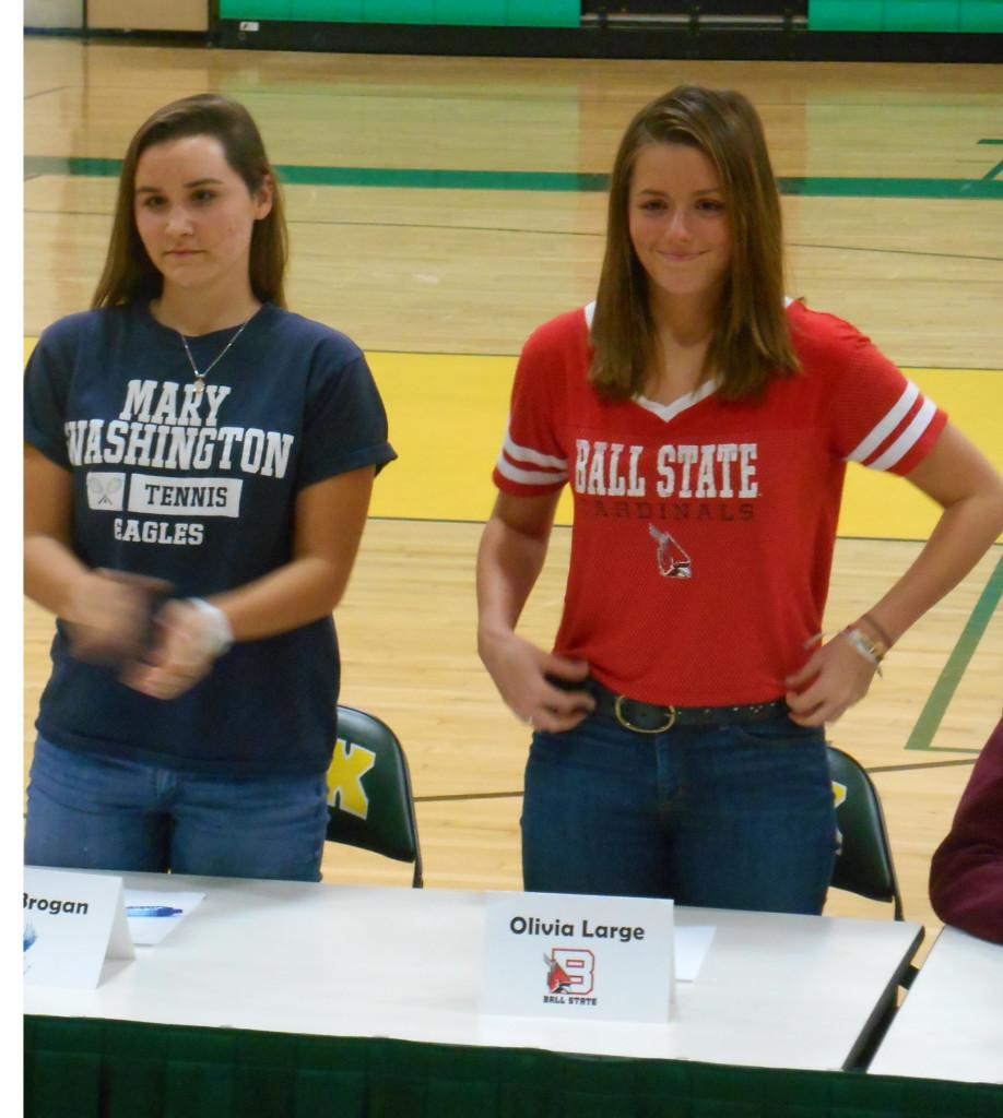SENIOR TENNIS PLAYERS Kait Brogan and Olivia Large sign with their respective colleges.