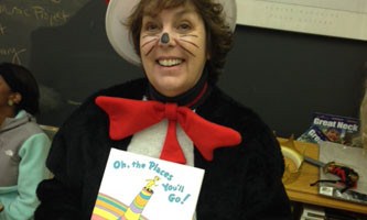 ENGLISH TEACHER MRS. Paradiso dresses up as Cat in the Hat to advirtise for the National English Honor Society book drive.