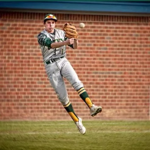 SOPHOMORE GARRETT LYONS throws the ball to first base against First Colonial High School.