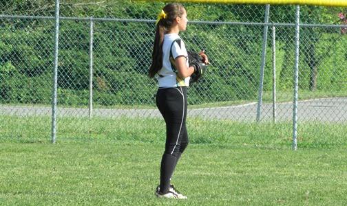 JUNIOR AMANDA MERFALEN anticipates a fly ball in the outfield.