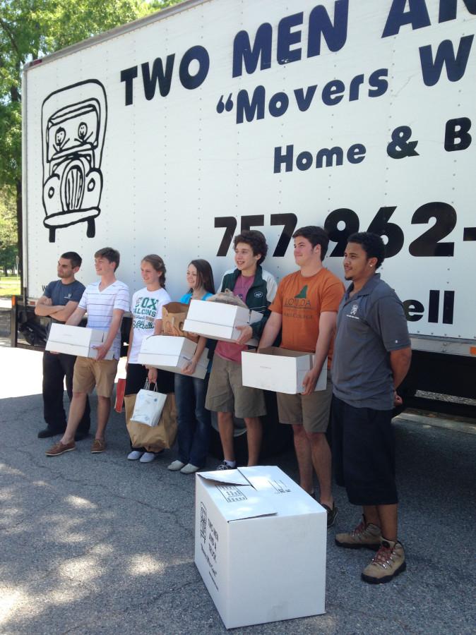 KEY CLUB MEMBERS prepare to load boxes in effort to give assistance to the Samaritan House.