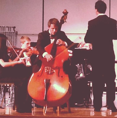 SENIOR WILL COLTHORPE performs at the Orchestra spring concert.