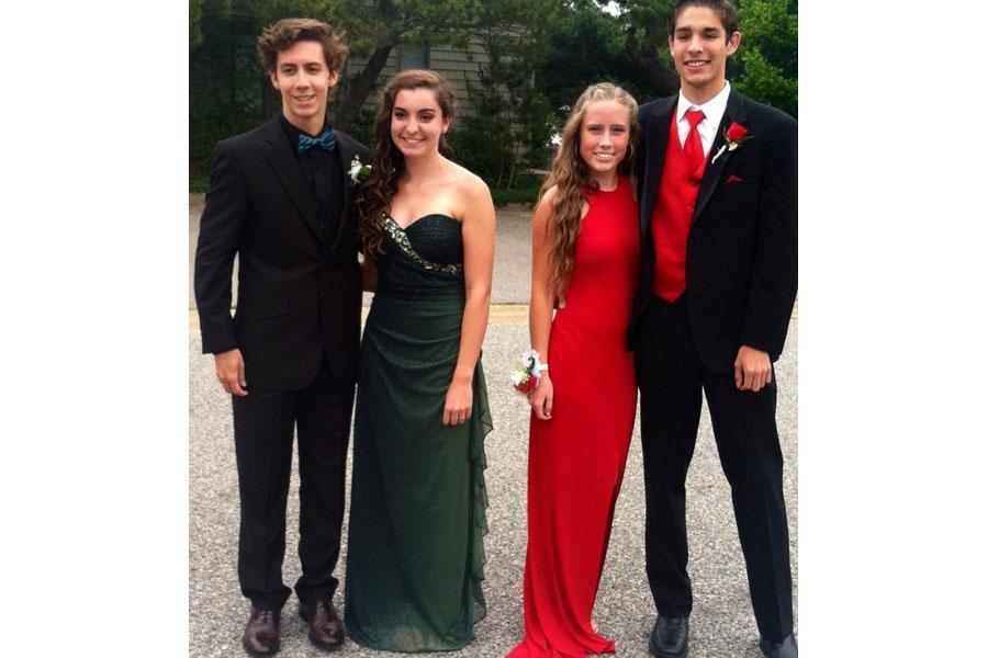 SENIORS ALEX MOCK and Austin Richardson pose with their dates before prom.