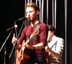 SINGER/SONGWRITER, TAYLOR Mathews, performs his latest hits for studets at a school assembly.
