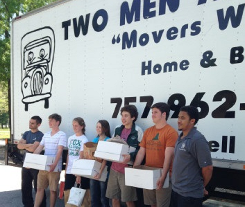 KEY CLUB MEMBERS prepare to load boxes in effort to give assistance to the Samaritan House.