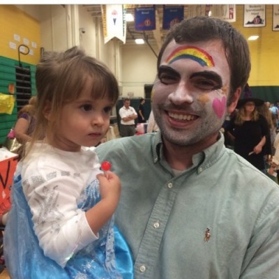 MATH TEACHER BRYAN Rudolph, pictured with his daughter, finds the humor in face painting at Boo Bash.