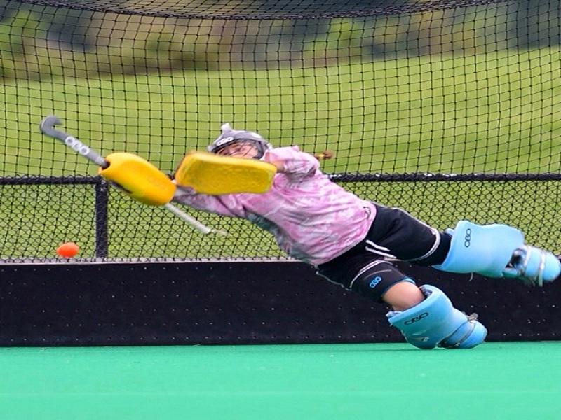 SENIOR SUZIE PILECKAS dives for a ball while playing for her club team.