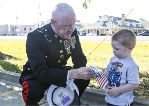 RETIRED US MARINE shows patriotism to the younger generation.