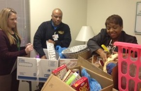 JENNIFER LEE, TONY Class, and Wendy Matthis compile Thanksgiving baskets for distribution this week.