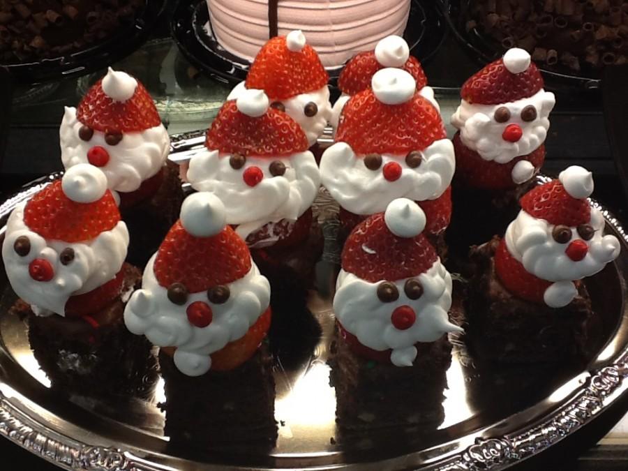 CATERING CLUB CREATES Santa Claus cupcakes to show off at Farm Fresh.