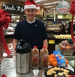 JUNIOR THOMAS STOUT from Key Club sells cider and clementines to customers
