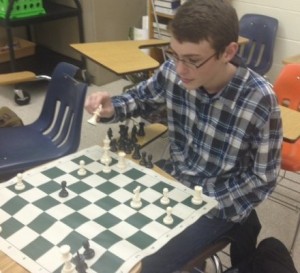 SOPHOMORE BOBBY GARDNER plans out his strategy at the recent chess club meeting.