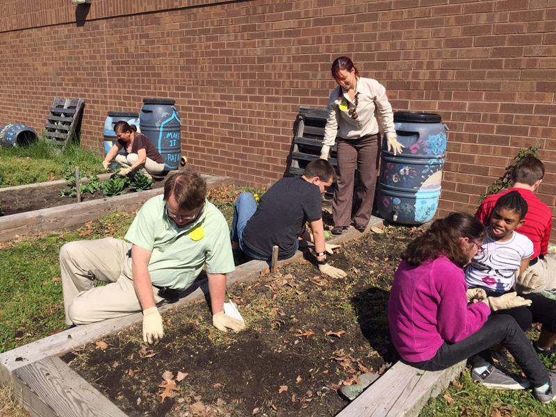 ENVIRONMENTAL CLUB MEMBERS participate in Earth Day.