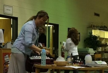 AS PART OF National Library Week, an essential oils representative shares her collection with students.