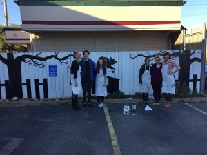 NATIONAL ART HONOR Society students recently painted a fence mural for local restaurant House of Bacon.
