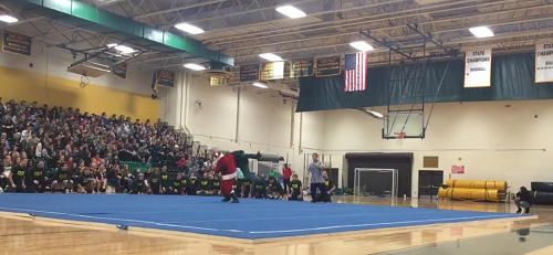 SANTA AND THE Grinch face off in a heated wresting match during the pep rally.