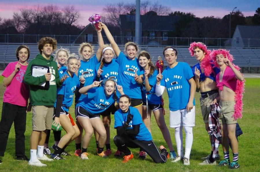 NO PUNT INTENDED receive the bedazzled football after winning the Powder Puff competition. 