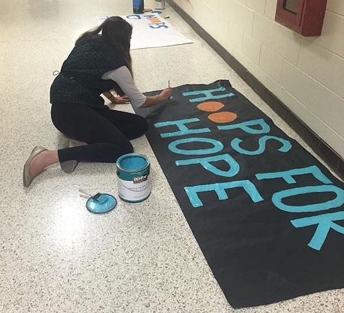 SCAS SAMANTHA Bonde prepares posters for Hoops for Hope benefitting CHKD, to be held on Feb. 2 at 6 p.m.