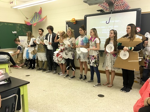 AP ENVIRONMENTAL STUDENTS present their recycled outfits.