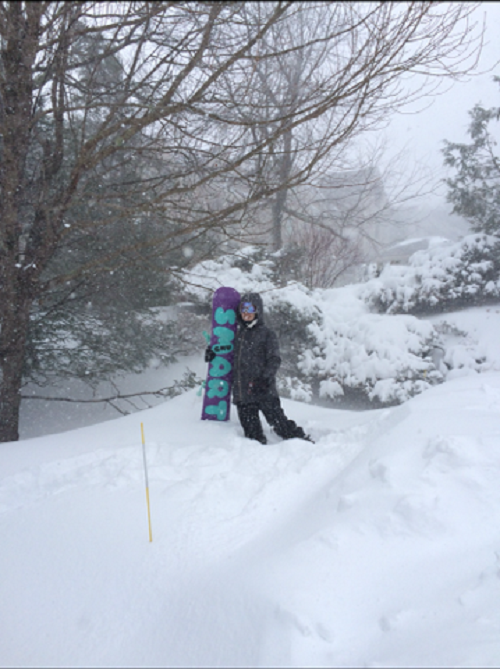 SKYLAR MAIHLES SMILES wide while surrounded by snow at Snowshoe. .