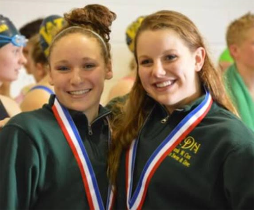 SENIOR KATHERINE DEGNER (R) poses with Abby Frey after their conference win.