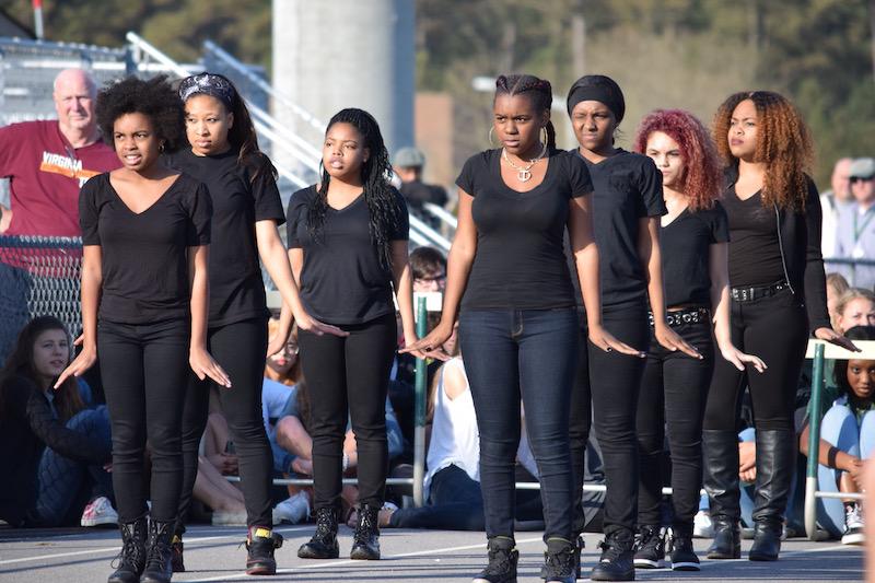 THE STEP TEAM performs at the Spring Pep Rally. 