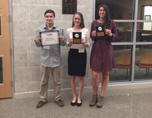 SENIORS PETER STERLING, Emily Staskin, and Brooke Moore pose with their [respective] awards.