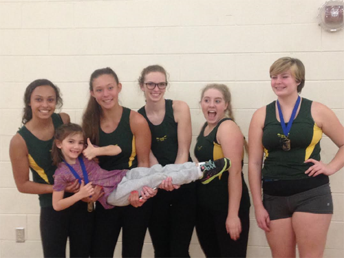 CREW TEAM MEMBERS sophomores Amaiah Hybbert, Sam Whitsel, Virginia Kayser, Lia Dopp and freshman Alex Greene show off their medals from the Hampton Roads Erg Pull. 