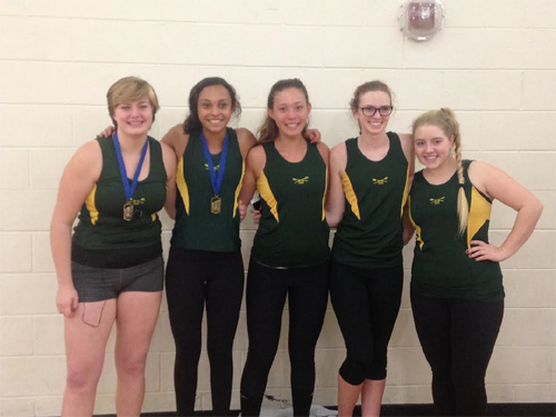 CREW TEAM MEMBERS sophomores Amaiah Hybbert, Sam Whitsel, Virginia Kayser, Lia Dopp and freshman Alex Greene show off their medals from the Hampton Roads Erg Pull. 