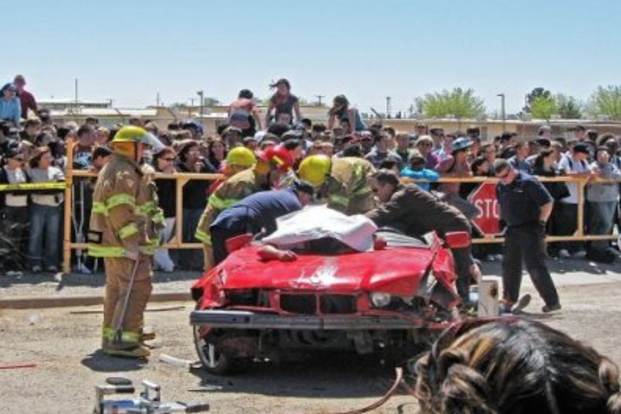 THE FIREFIGHTERS RESCUE victims in this reenactment of a car crash in Every 15 Minutes.