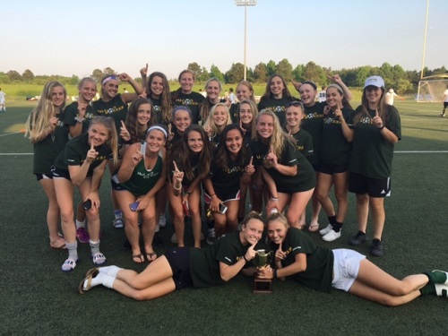 GIRLS VARSITY SOCCER claims the trophy for winning first place in Conference 6A season. 