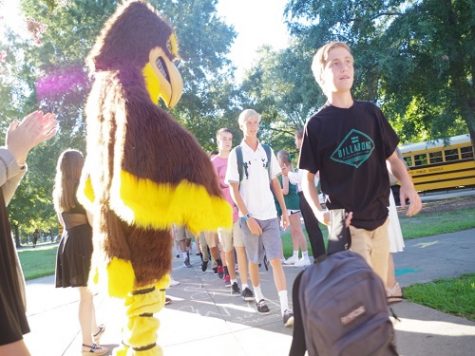 THE FALCON MASCOT welcomes new freshman to the school at Falcon Fest last month.