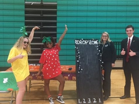 JUNIORS KELSEY LIPSCOMB, Ciara Vakos, and Ian Lichacz pose at Boo Bash with Mrs. Wolfe.