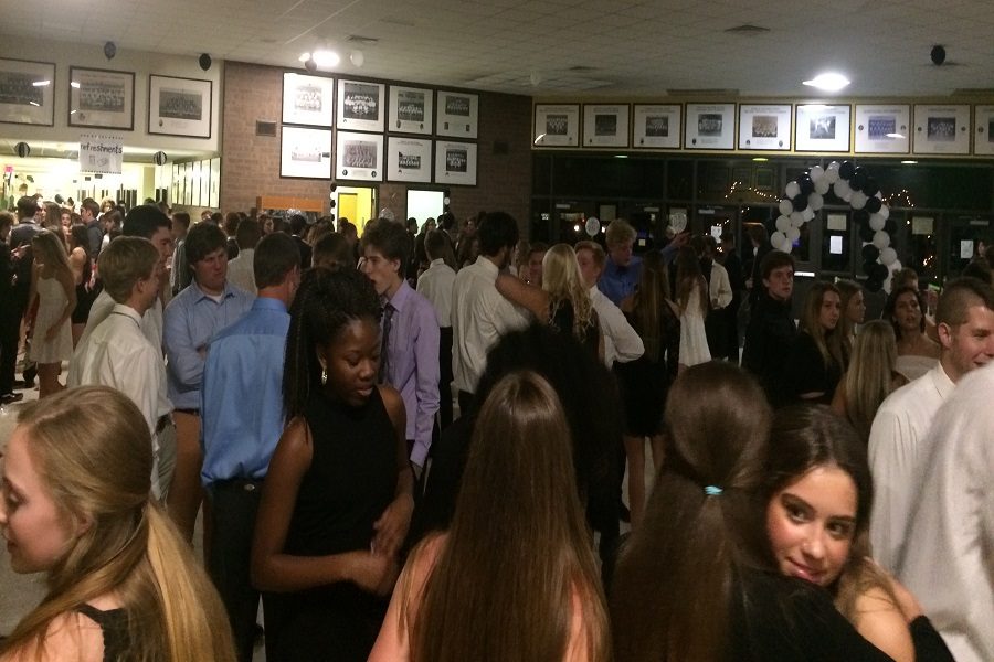 STUDENTS FROM ALL grades mingle at the Homecoming dance.