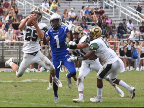 JUNIOR ZACK MAURER intercepts the ball from Landstown's offense.