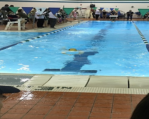 SENIOR ELLIE GILDEN swims the relay during the teams last meet.