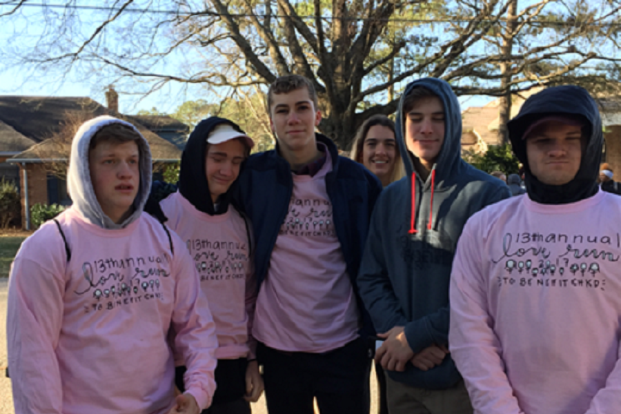 RUNNERS DON THEIR 2017 CHKD Love Run shirts on race day.