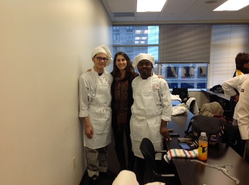 SENIORS BRIAN LEON and Tyrone Nixon pose with teacher Raena Weimer at the C-CAP culinary competition.