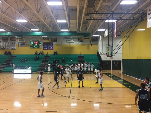 BOYS BASKETBALL TAKES on rival First Colonial.