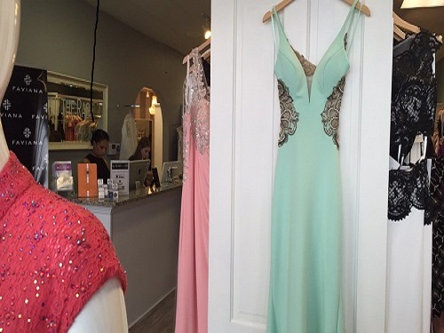 PROM AND RING Dance dresses from All the Rage, a local shop many high schoolers frequent to find formal dresses.