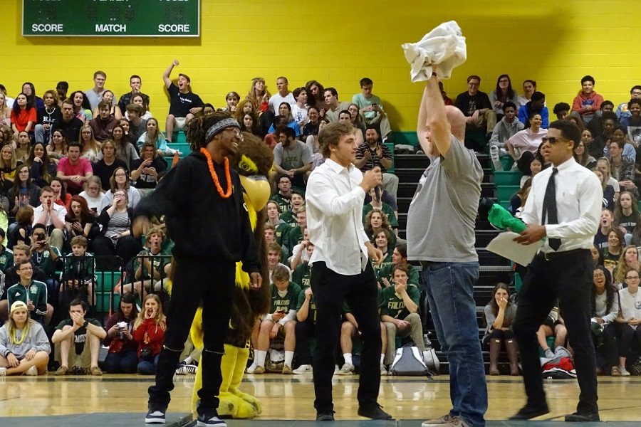 JUNIOR MIKEY LOGAN (L-R) SCA President Frayser Wall, English teacher Eric Bodenstein, and SCA Vice President A.J. Smith let students be the judges of the student versus teacher dance off today at the spring pep rally.