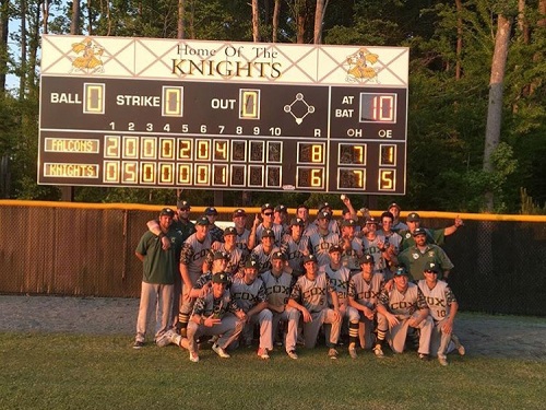 FALCONS BASEBALL TEAM poses in front of the score board after winning conference title.