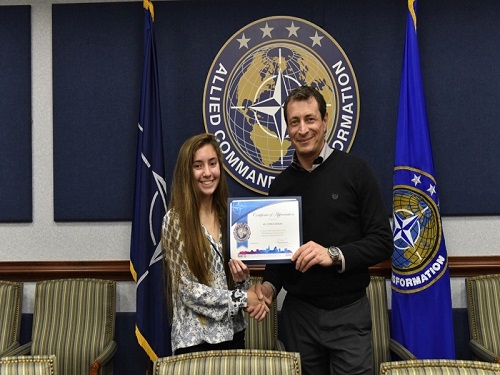SOPHOMORE SYDNEY DOYON (left-right) was awarded a Certificate of Appreciation by mentor and NATO Public Affairs Officer Paolo Giordano for her work with the NATO Press Corps.