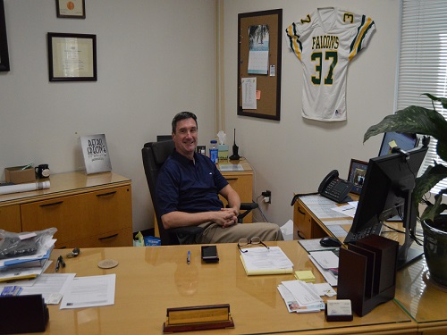 NEW PRINCIPAL DR. Michael Kelly in his office; the calm before the storm.