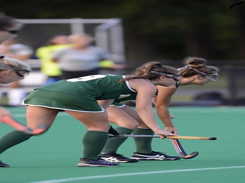 SOPHOMORE KYLIE LEVINE and junior Sam Zywna get ready to strike on a corner.