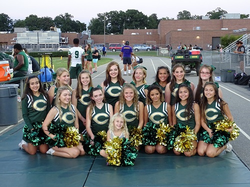 JUNIOR VARSITY CHEERLEADERS pose for a team picture