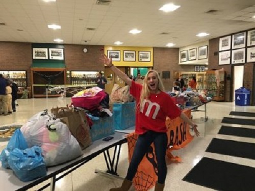 JUNIOR KENZIE WALL collects sweatshirts for Birdneck Elementary for SCAs Hoodies for the Holidays project.